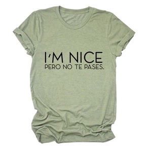Sage green short sleeve t-shirt with I'M NICE PERO NO TE PASES text print on front