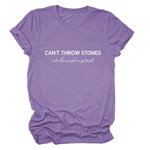 Detail of CAN'T THROW STONES letter print on a purple cotton blend short sleeve T-shirt