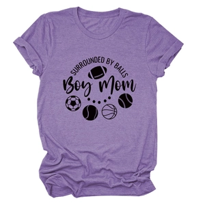 Close-up of soft purple cotton t-shirt with sports ball icons and Boy Mom lettering