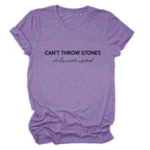 Detail of purple heather texture and black slogan print on a casual cotton T-shirt