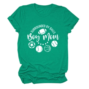 Detail of green cotton T-shirt with 'Boy Mom' text and sports ball icons on white background