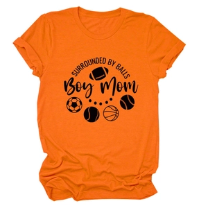 Detail of rolled cuff and sports print on orange cotton crew neck t-shirt