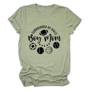 Detail of sage green T-shirt with SURROUNDED BY BALLS Boy Mom text and sports ball icons