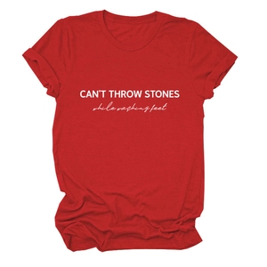 Detail shot of slogan print and cotton knit texture on this red crew neck t-shirt