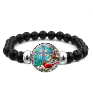 Bracciale elastico con perline nere con ciondolo uccello cardinale e croce per donna
