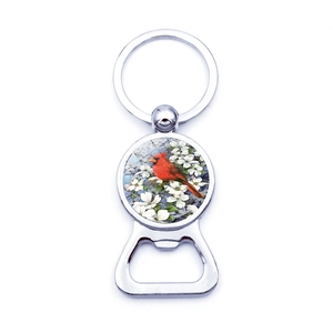 Detailed view of cardinal bird keychain bottle opener with floral print and silver finish