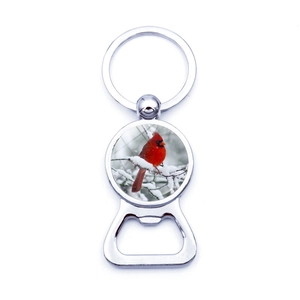 Cardinal bird bottle opener keychain with glass gem and winter snow scene design