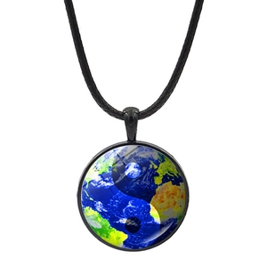 Detail of Yin Yang earth pattern glass dome pendant on a black cord necklace