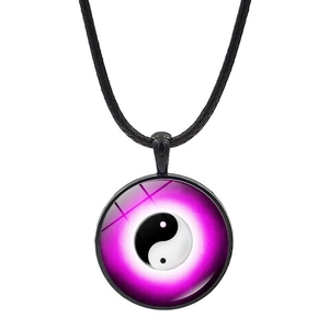 Macro view of Yin Yang Tai Chi pendant with purple gradient and black cord