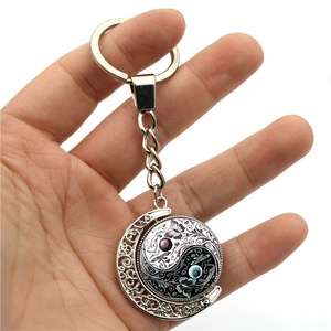 Yin Yang butterfly moon keychain with rotating glass pendant in silver finish