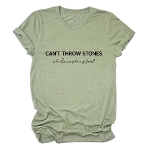 Detail of light green cotton T-shirt featuring CAN'T THROW STONES letter print design