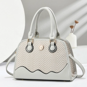 Elegant herringbone fabric shell bag with grey leather trim and gold metal emblem