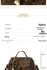Brown vintage textured handbag with pearl charm and dimensions 26x12x16 cm shown
