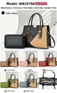Detailed view of color-block tote bag 31x14x24cm with heart charm and matching pouch