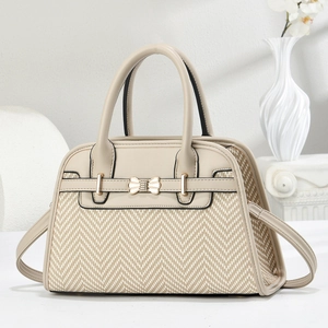 Elegant beige tote bag with herringbone weave and a stylish metal bow buckle decoration