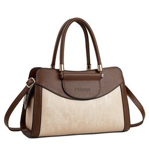 Elegant two-tone brown and beige tote bag with twin handles and detachable strap