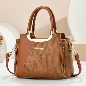 Elegant brown faux leather tote bag with vertical stripes and golden metal handles