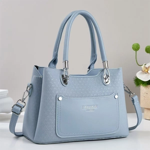 Light blue woven textured tote bag with top handles and adjustable shoulder strap