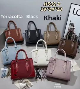 Detailed display of large luxury hand bags in 8 colors with metallic clasps and straps