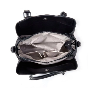 Interior view of black tote bag showing multiple compartments and chevron lining