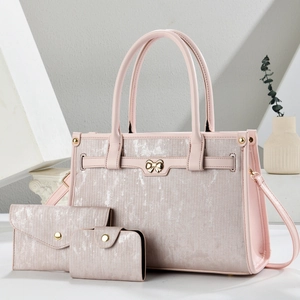 Pink three-piece tote bag set with glossy texture and gold butterfly buckle for women