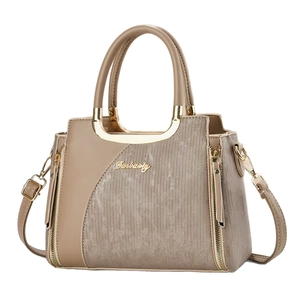 Beige faux leather tote bag with vertical stripes and gold hardware in front view