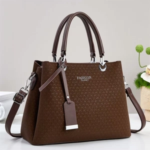 Brown woven texture tote bag with leather handles and Fashion Queen logo print