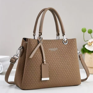 Classic brown woven texture handbag with dual handles and adjustable shoulder strap