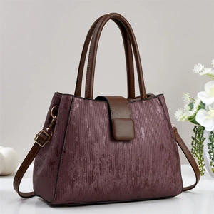 Elegant wine red leather tote bag with dark brown straps and large capacity design