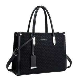 Elegant black woven tote bag with premium leather trim and detachable shoulder strap