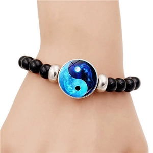 Beaded Yin Yang dragon bracelet with black round beads and silver metal accents