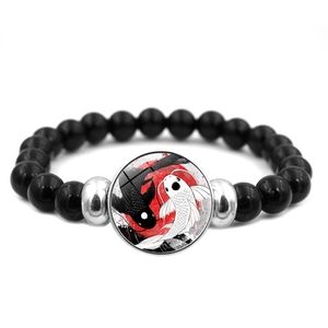 Yin Yang Koi Fish beaded bracelet with black elastic beads and silver accents