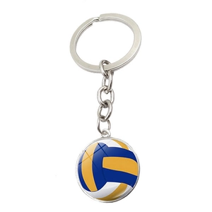 Vue détaillée du porte-clés volley-ball en verre avec motif bleu jaune blanc