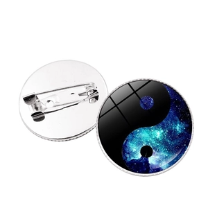 Detailed view of Yin Yang galaxy brooch with secure pin backing and glass dome surface