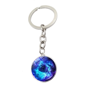 Cosmic galaxy keychain featuring a blue nebula crystal glass dome pendant on silver ring
