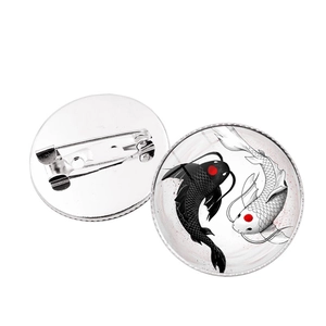 Yin Yang Koi Fish Dragon Moon brooch with polished black and white enamel finish