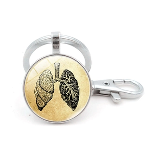 Detailed macro of the human lung anatomy illustration inside a glass dome keychain