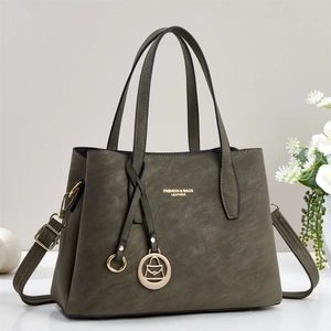 Olive green suede tote bag with top handles, gold hardware and detachable shoulder strap