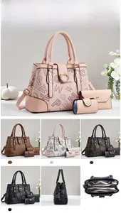 Detailed view of large monogram tote bag with matching envelope pouch and card holder
