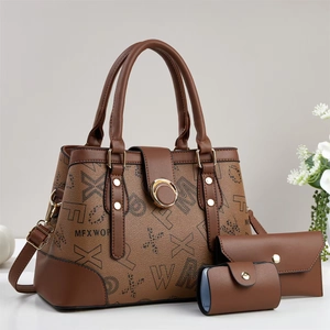 Detailed set of three brown monogram tote bags including clutch and coin purse