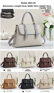 Detailed view of women's handbag with size 25x10x19cm and three-layer interior structure