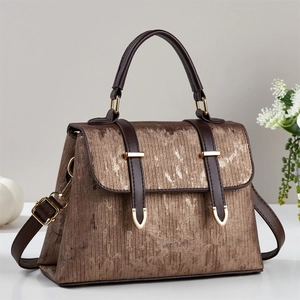 Brown vintage handbag with metallic texture and gold accents for stylish daily commuting