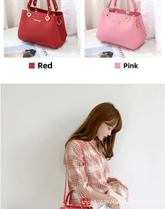 Close-up of Danbaoly handbags in red and pink with golden metal hardware detail