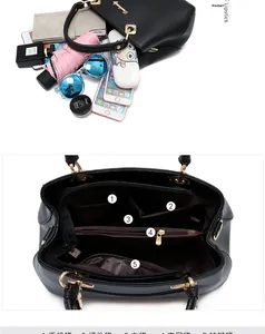 Detailed interior of a black leather handbag showing five functional storage compartments