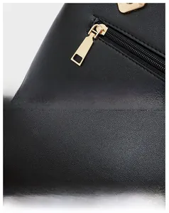 Detail view of smooth black PU leather texture and premium gold-tone metal zipper hardware