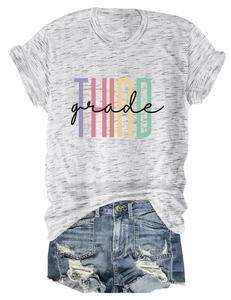 Detail of grey THIRD grade printed t-shirt with ripped blue denim shorts set