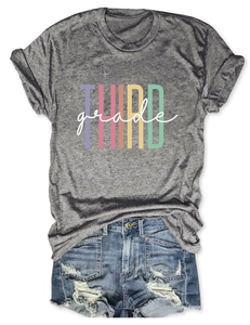 Detail of grey Third Grade graphic t-shirt tucked into frayed denim shorts