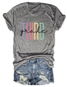 Close-up of heather grey Third Grade printed T-shirt with distressed denim shorts