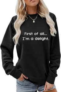 Close-up of First of all text print on black crewneck sweatshirt with ribbed collar detail