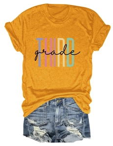 Detail of THIRD grade printed yellow cotton T-shirt paired with ripped denim shorts